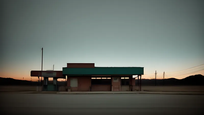 An empty desert highway under a green-tinged sky with a gas cloud rolling across it, repertory cinema poster in teal and amber