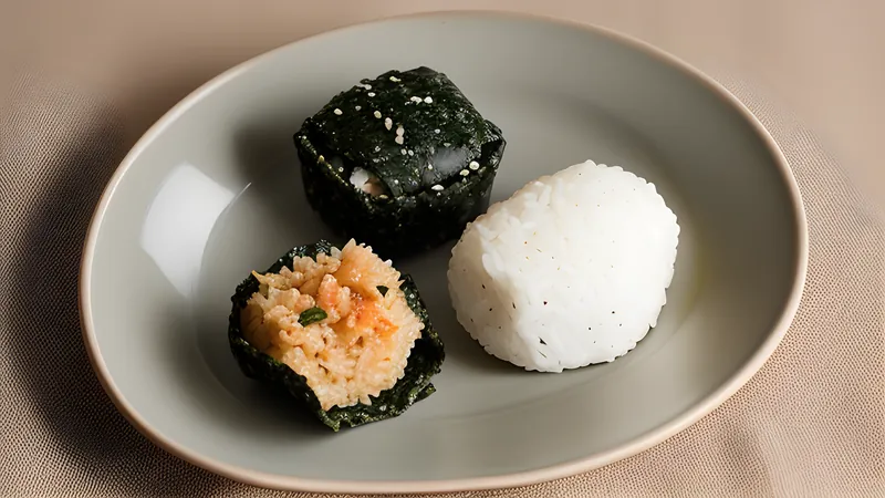 Three triangular onigiri wrapped in nori, filled with umeboshi, salmon and okaka