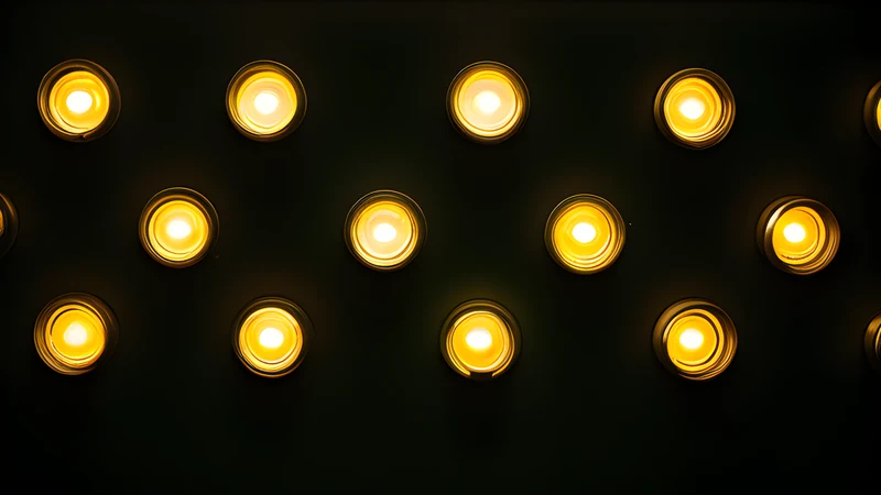 A wall of small status lights, all green, one blinking amber
